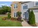 Close-up view of a home's exterior, showcasing the stone facade, front door, and landscaping at 2261 Seatton Ct, Marietta, GA 30062