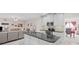 Kitchen featuring granite countertops, stainless steel appliances, and open flow to living room and dining room at 2261 Seatton Ct, Marietta, GA 30062
