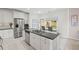 Bright kitchen with granite countertops, stainless steel appliances, large island, and eating area at 2261 Seatton Ct, Marietta, GA 30062