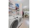 Spacious laundry room featuring modern washer and dryer, storage shelves, and organized storage solutions at 2261 Seatton Ct, Marietta, GA 30062