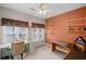 Office with shelving, large windows, desk, and neutral carpeting at 2261 Seatton Ct, Marietta, GA 30062