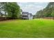 Large backyard with ample space and potential for various outdoor activities at 6610 Major Dr, Cumming, GA 30040