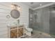 Updated bathroom featuring wood-look tile, modern vanity, and a glass enclosed shower at 6610 Major Dr, Cumming, GA 30040