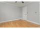 Bedroom with hardwood floors and an interior door at 6610 Major Dr, Cumming, GA 30040