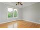 Neutral bedroom with hardwood floors and large windows at 6610 Major Dr, Cumming, GA 30040