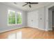 Bedroom with hardwood floors, interior doors, and a ceiling fan at 6610 Major Dr, Cumming, GA 30040