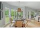 The dining area has large windows with wooded view at 6610 Major Dr, Cumming, GA 30040