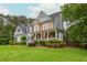 Charming front exterior with a welcoming porch and well-maintained landscaping at 6610 Major Dr, Cumming, GA 30040