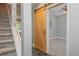 Hallway featuring a decorative sliding wooden barn door and staircase with metal accents at 6610 Major Dr, Cumming, GA 30040