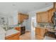 Spacious kitchen features wood cabinets, stainless steel appliances, and hardwood floors at 6610 Major Dr, Cumming, GA 30040
