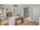 Inviting living room with stone fireplace, built-in shelves, and hardwood flooring at 6610 Major Dr, Cumming, GA 30040