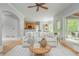 Open living space with kitchen views, hardwood floors, and an access to the outdoor porch at 6610 Major Dr, Cumming, GA 30040