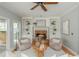 Charming living room featuring a fireplace, built-ins, and hardwood floors at 6610 Major Dr, Cumming, GA 30040