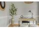 Close-up of a modern home office with desk, seating, plants, and decorative mirror at 6610 Major Dr, Cumming, GA 30040