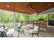 Enjoy this outdoor patio with built-in stone grill and dining area under a stunning wood ceiling at 6610 Major Dr, Cumming, GA 30040