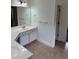 Bright bathroom with double vanity, ample counter space, and decorative mirrors at 753 Hayes Ct, Atlanta, GA 30349