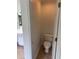Compact bathroom features a toilet and access to a sink with tiled floor at 753 Hayes Ct, Atlanta, GA 30349