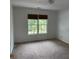 Bedroom with carpet and two windows with wood blinds at 753 Hayes Ct, Atlanta, GA 30349