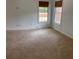 Bedroom with carpet and two windows with wood blinds at 753 Hayes Ct, Atlanta, GA 30349