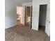 Spacious carpeted bedroom with a closet and ensuite bathroom view at 753 Hayes Ct, Atlanta, GA 30349