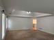 Primary bedroom with tray ceiling, ceiling fan, and an en-suite bathroom at 753 Hayes Ct, Atlanta, GA 30349