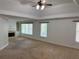 Carpeted primary bedroom featuring a cozy fireplace with built-in shelving at 753 Hayes Ct, Atlanta, GA 30349