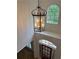 Grand foyer features a stunning chandelier, arched windows, and wood flooring at 753 Hayes Ct, Atlanta, GA 30349
