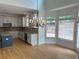Bright kitchen features stainless appliances, tile backsplash and adjacent dining area with many windows at 753 Hayes Ct, Atlanta, GA 30349