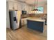 Well-appointed kitchen with island, stainless steel appliances, and stylish backsplash at 753 Hayes Ct, Atlanta, GA 30349