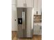 Stainless steel refrigerator featuring water dispenser and ice maker is a modern kitchen upgrade at 753 Hayes Ct, Atlanta, GA 30349