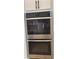 This kitchen is equipped with stainless steel double ovens for all of your cooking needs at 753 Hayes Ct, Atlanta, GA 30349