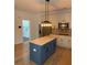 Gourmet kitchen with large island, stainless steel appliances, and white cabinetry at 753 Hayes Ct, Atlanta, GA 30349