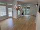 Open-concept living room with hardwood flooring, fireplace, and glass patio doors at 753 Hayes Ct, Atlanta, GA 30349