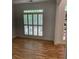 Bright living room with shuttered windows and hardwood floors at 753 Hayes Ct, Atlanta, GA 30349
