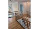 Elegant staircase with wood treads, decorative iron balusters, and natural light at 753 Hayes Ct, Atlanta, GA 30349