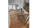 Staircase with hardwood floors and iron railing overlooks a bright, open floor plan at 753 Hayes Ct, Atlanta, GA 30349