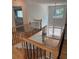 Open staircase with hardwood floors and iron railing, providing a view of the living spaces at 753 Hayes Ct, Atlanta, GA 30349