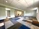 Open basement area with patterned carpeting, offering plenty of potential at 942 Batesville Rd, Canton, GA 30115