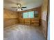 Neutral bedroom with beige carpet and light brown walls. Has a ceiling fan and large window at 942 Batesville Rd, Canton, GA 30115