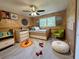 Cozy bedroom featuring a trundle bed, playful decor, and ample natural light at 942 Batesville Rd, Canton, GA 30115