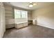 Bedroom featuring a large built-in bookcase, desk, and window with natural light at 942 Batesville Rd, Canton, GA 30115