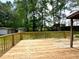 Spacious wooden deck ideal for outdoor gatherings or relaxation amidst nature at 942 Batesville Rd, Canton, GA 30115