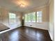 Dining area with hardwood floors and large windows, great for entertaining guests at 942 Batesville Rd, Canton, GA 30115
