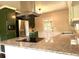 Stylish kitchen featuring granite counters, stainless steel appliances, and a modern design at 942 Batesville Rd, Canton, GA 30115