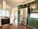 Modern kitchen with stainless steel appliances, granite countertops, and wooden cabinets at 942 Batesville Rd, Canton, GA 30115