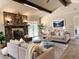 Cozy living room featuring a stone fireplace and comfortable seating at 942 Batesville Rd, Canton, GA 30115