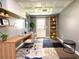 Well-lit home office with a custom desk, shelving, and unique ceiling tiles at 942 Batesville Rd, Canton, GA 30115