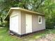 Exterior view of outbuilding with garage door at 942 Batesville Rd, Canton, GA 30115