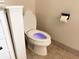 Close up on modern toilet with seat up at 942 Batesville Rd, Canton, GA 30115