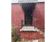 Exterior home image featuring weathered siding and a wrought iron security door at 2625 Baker Nw Rd, Atlanta, GA 30318